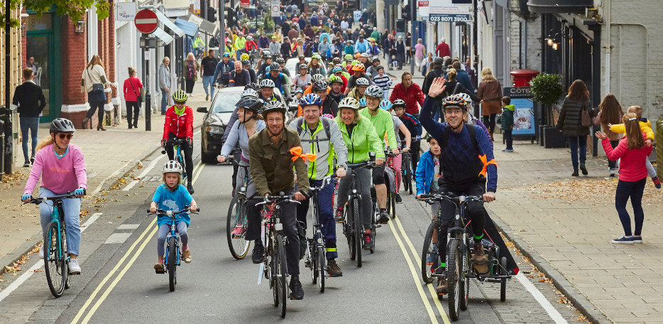 Massed cyclists approach Westgate as part of Mass Ride 5, 2021