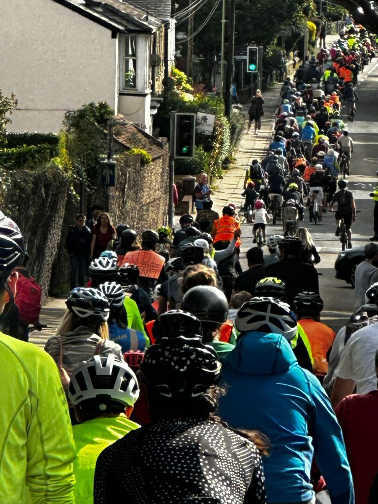 View of hundreds of cyclists streaming down North Walls during Mass Ride 7