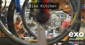 Photo of people working in a bike workshop
